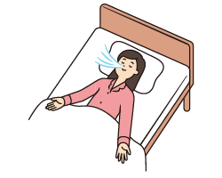 ベッドで仰向けになり深呼吸をする女性のイメージ図。